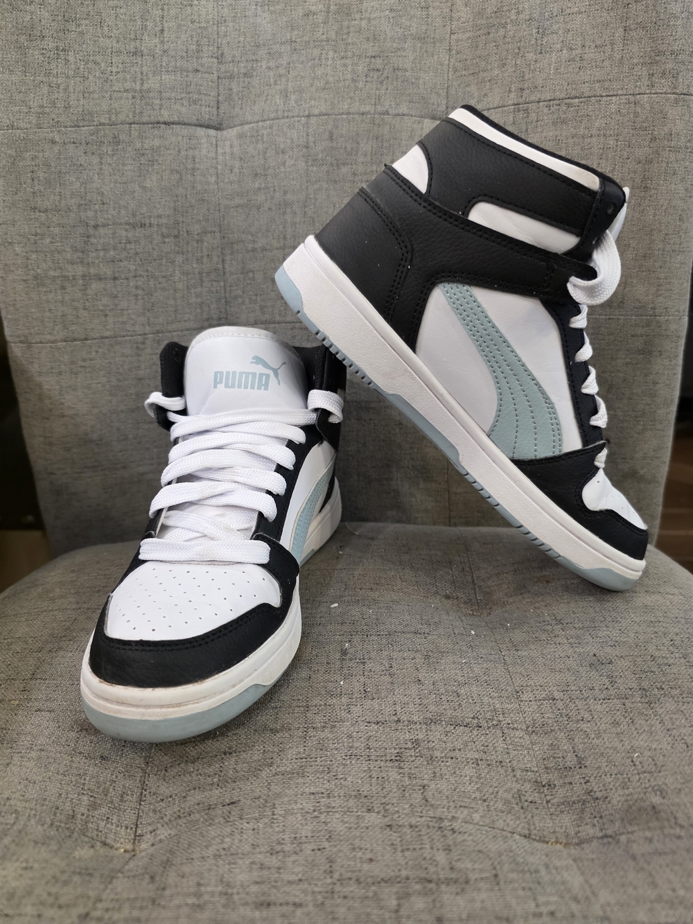 White, black, and light-blue Puma Rebound LayUp SL women's high-top lifestyle